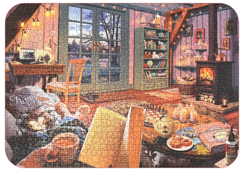 Picture of a completed jigsaw puzzle showing a cosy living room with a desk, fireplace, bookshelf, French doors, wooden beams and a wooden floor. In the foreground a woman's hands are holding an open book and a mug of tea. A cat is curled up next to her on the sofa and next to the sofa a dog sleeps under a table laden with a chess board, candles, a teapot, 3 pastries, postcards, a scrapbook and a pot of glue.